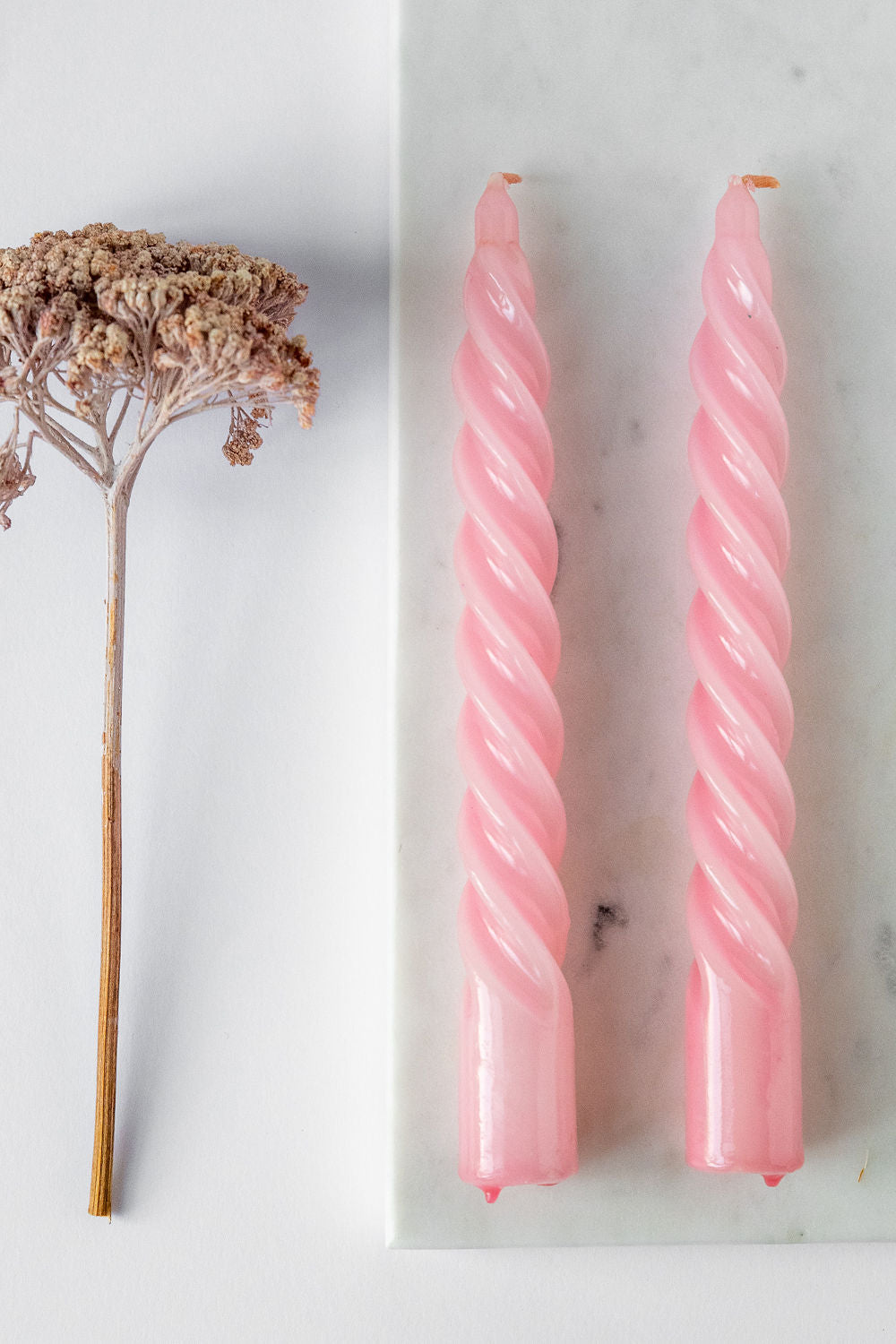 Set of spiral candles in light pink color shades