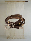 Celeni chocolate brown genuine leather belt with gold and silver studs and a western-style buckle.