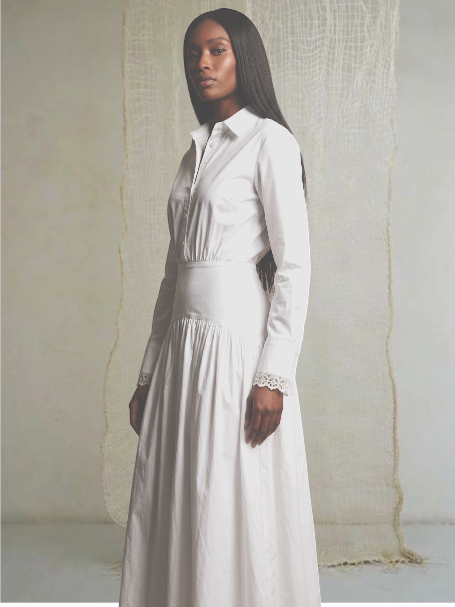 Celeni white cotton poplin maxi shirt dress with special hip cut and vintage lace detail on collar and cuffs. Model is 177cm.